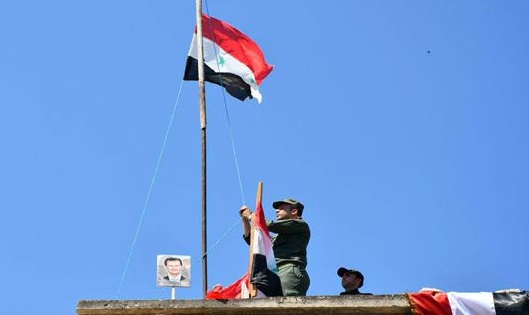 Syria national flag hoisted over Hor Binafseh in Hama