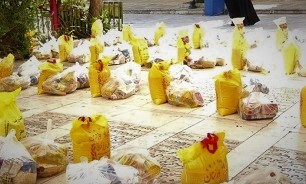 برپایی آیین توزیع ۱۲۰۰ بسته معیشتی در گلزار شهدای قم